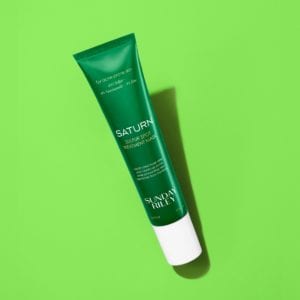 Thin green bottle with white cap.