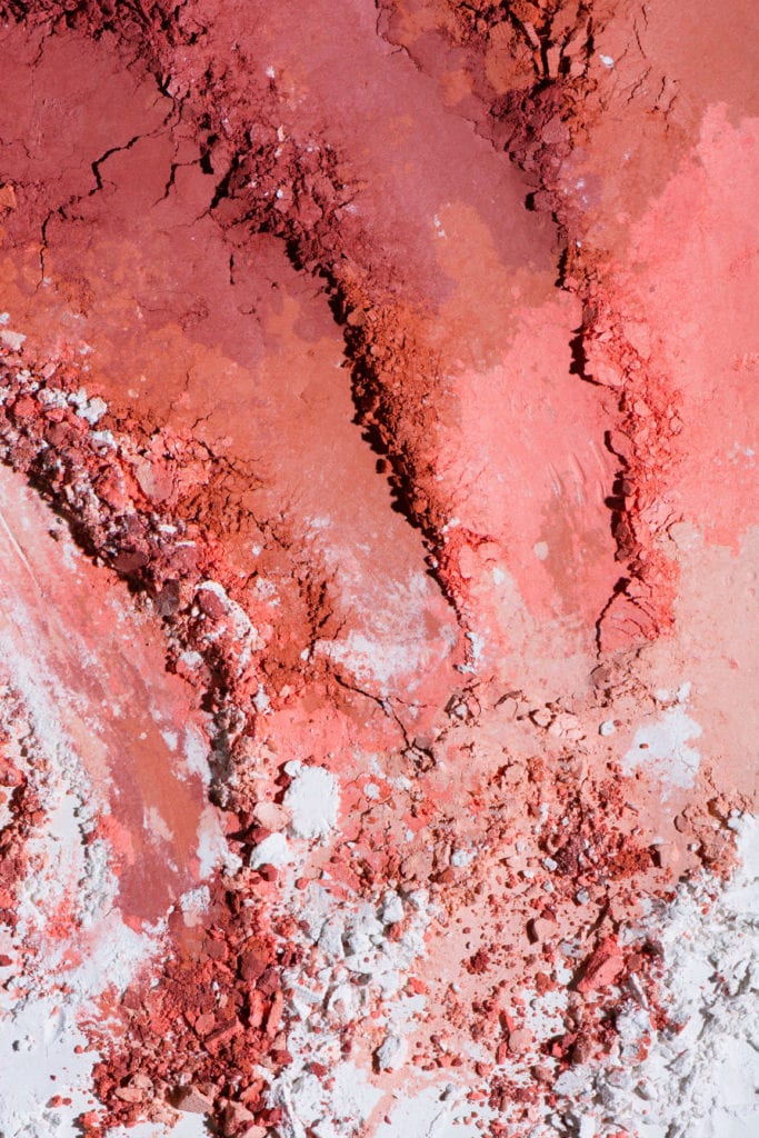A swatch of crushed powder from a makeup palette.