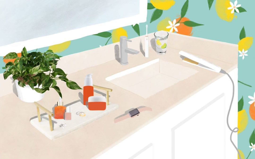 An illustration of a bathroom counter with vitamin c products, a watch, jewelry and flat iron.