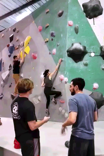 The Sunday Edit writer, Mellanie Perez, climbs a wall in an indoor climbing gym.