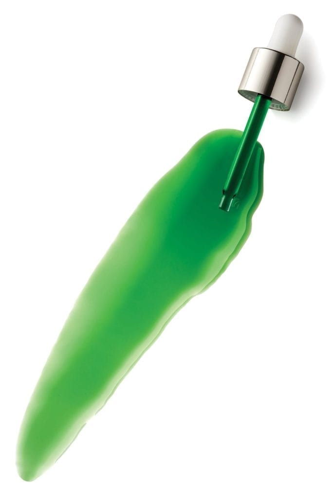A goop shot of green U.F.O. Oil with dropper on white.
