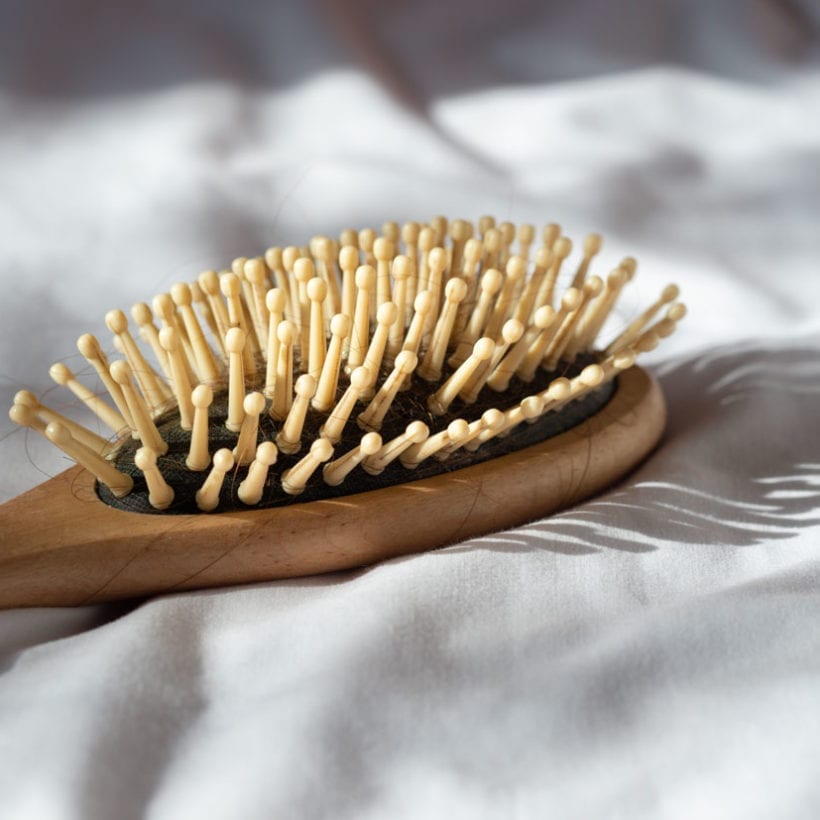 A brush with strands of hair.