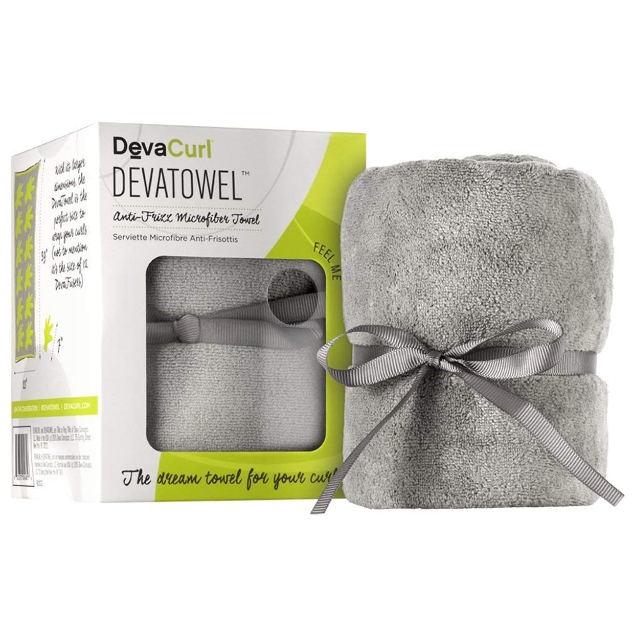 A grey towel tied with a grey ribbon next to a white and green box.