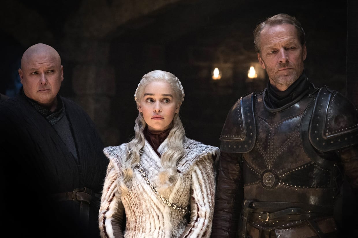 Conleth Hill, Emilia Clarke, and Iain Glen in a scene from HBO's "Game of Thrones."