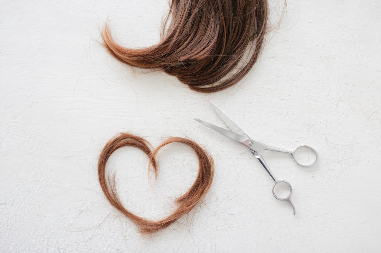 An overhead shot of cut hair and scissors.