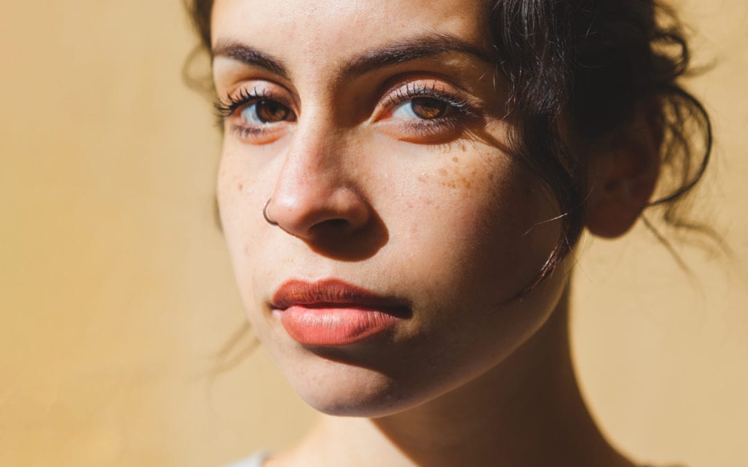 Close up of a mixed race woman in the sun.