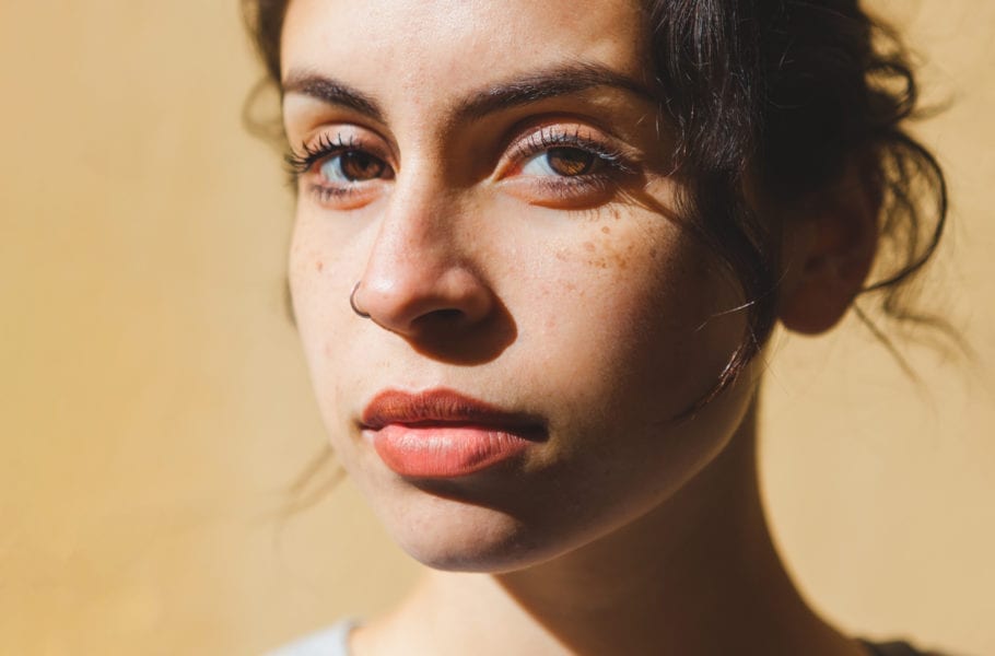Close up of a mixed race woman in the sun.