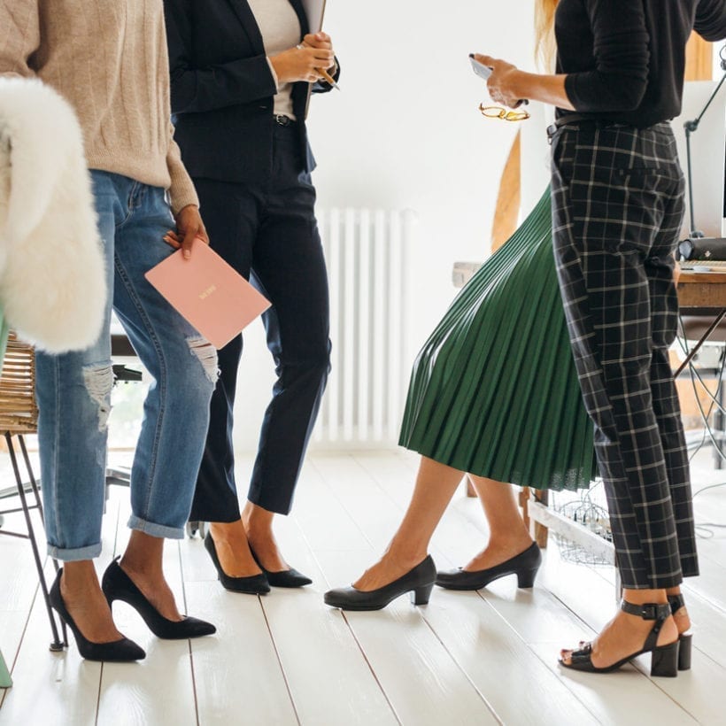 Close up of a female team working in an office.