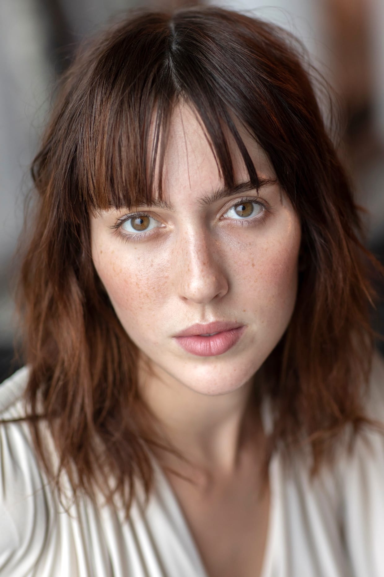 A close up of a woman's face with sensitive skin.