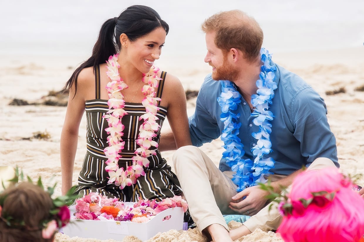 Prince Harry and Meghan Markle with local surfing community group 'OneWave' on Bondi Beach, Oct. 18, 2018.