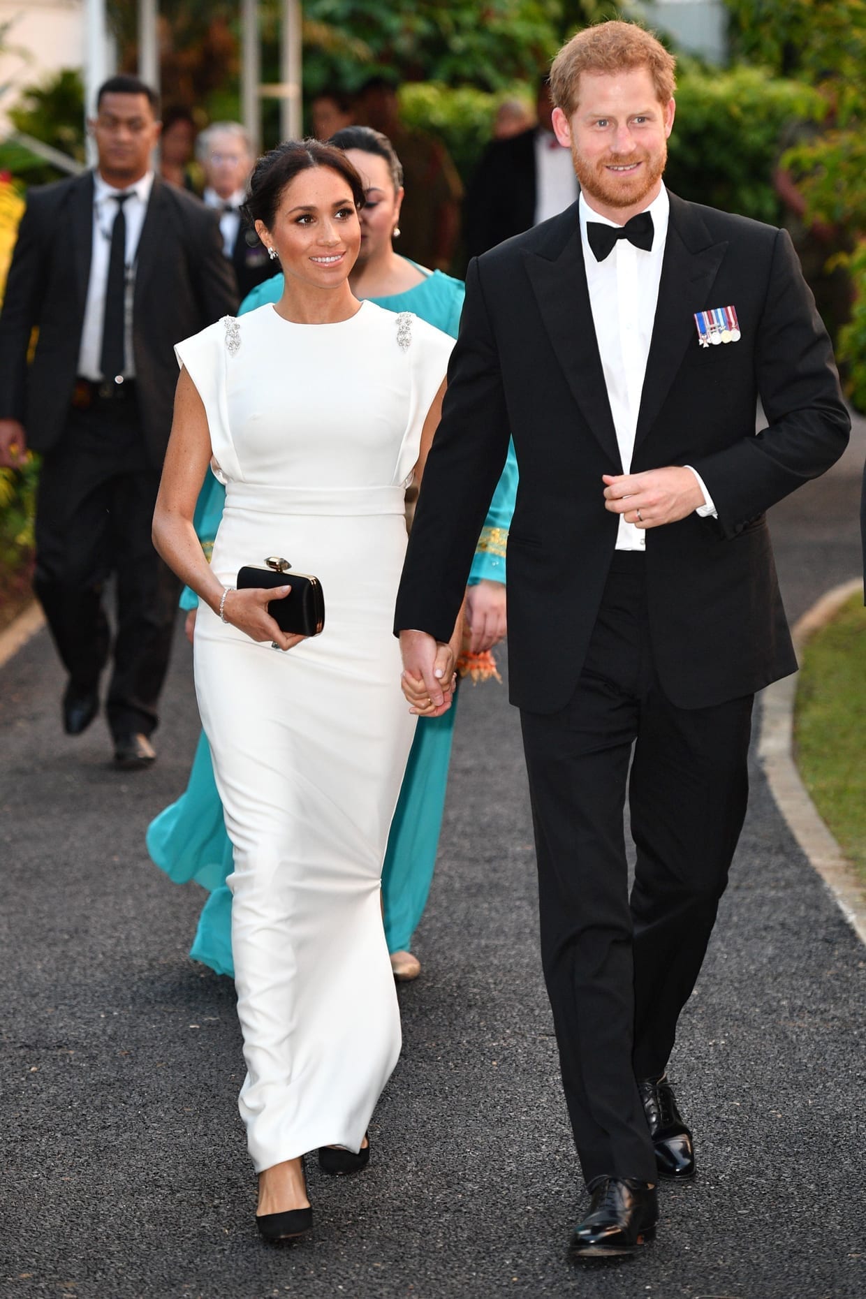 Prince Harry and Meghan Markle arrive for a reception and dinner at the palace in Nuku'alofa, Oct. 25 2018.