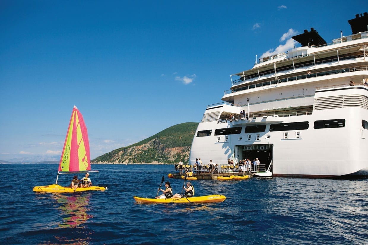 A cruise ship with people on floats.