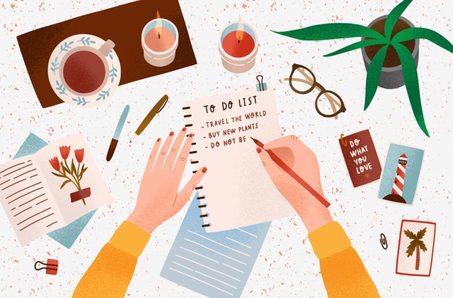 Woman's hands holding pen and writing down goals to achieve in notepad or making to do list.