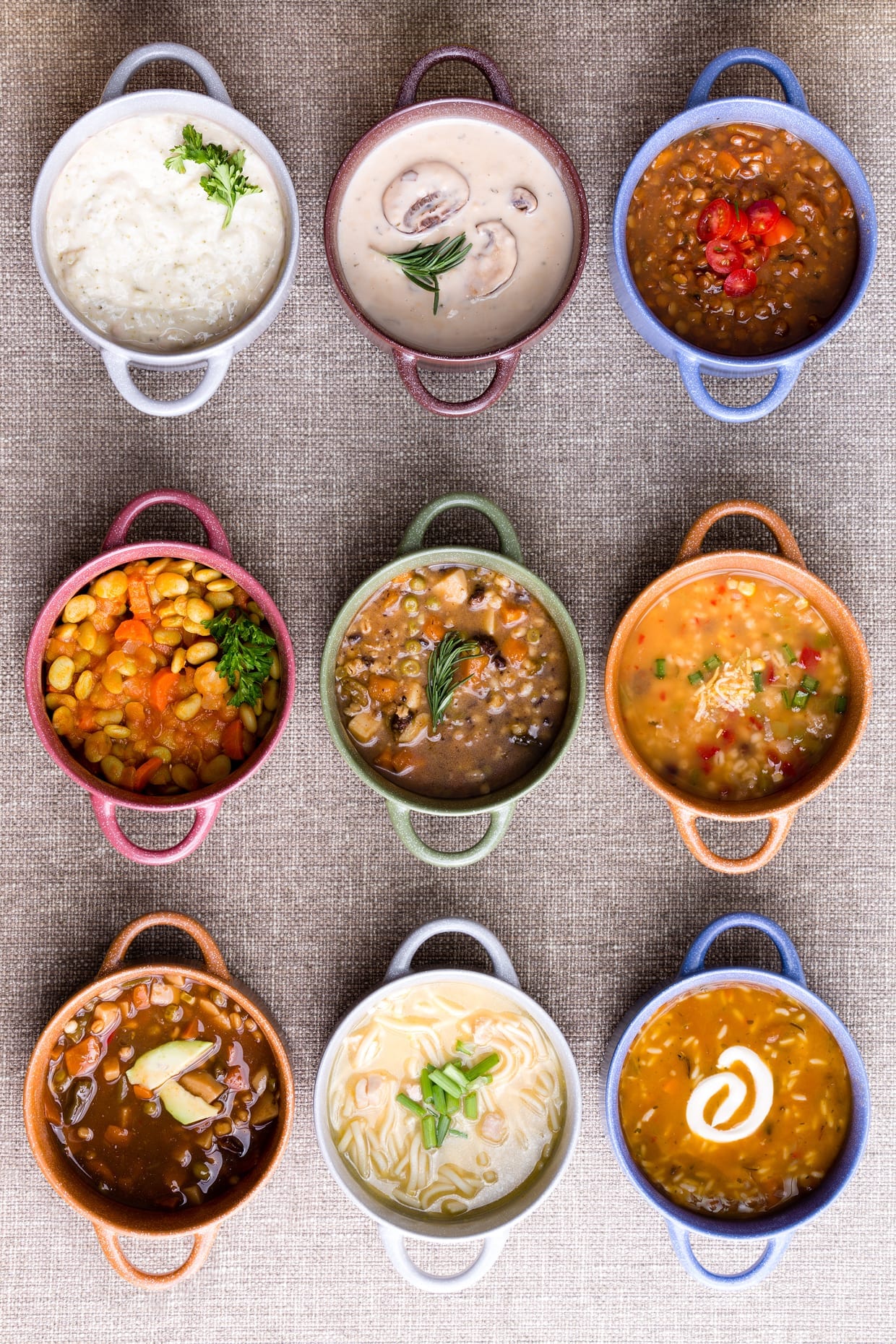 An overhead shot of a variety of soups.