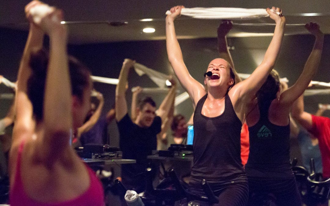 A woman yelling at at a spin class.