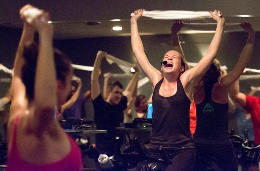A woman yelling at at a spin class.
