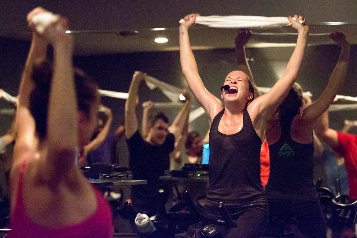 A woman yelling at at a spin class.