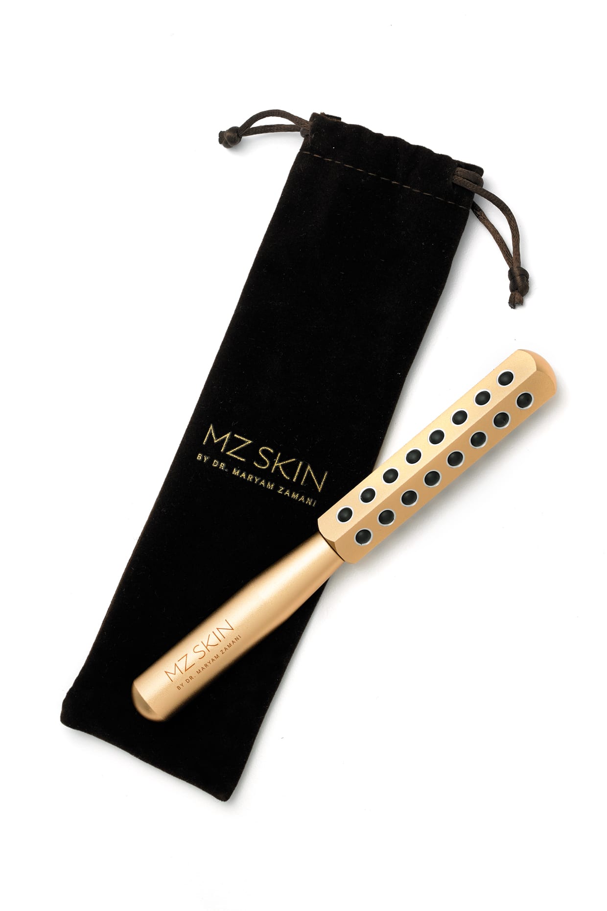 A gold facial roller with a black pouch.