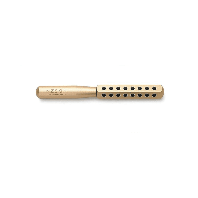 A gold facial roller.