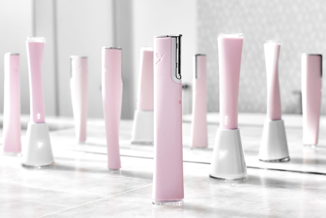 A group of pink and silver beauty skincare gadgets.