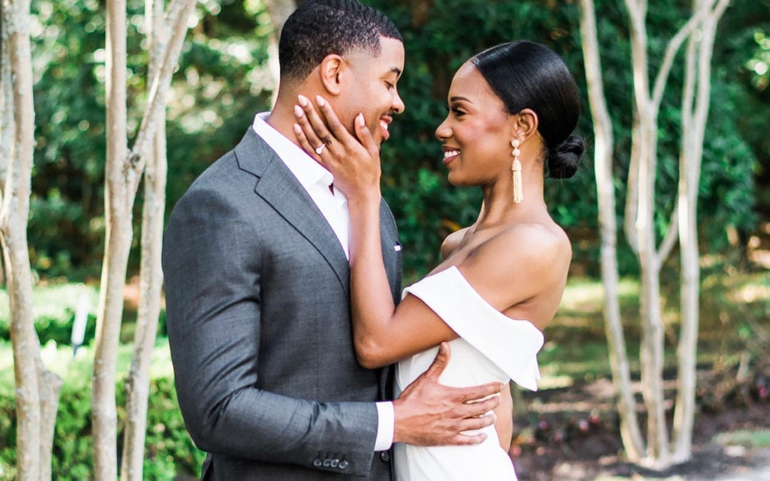 A man and a woman posing for an engagement photo.