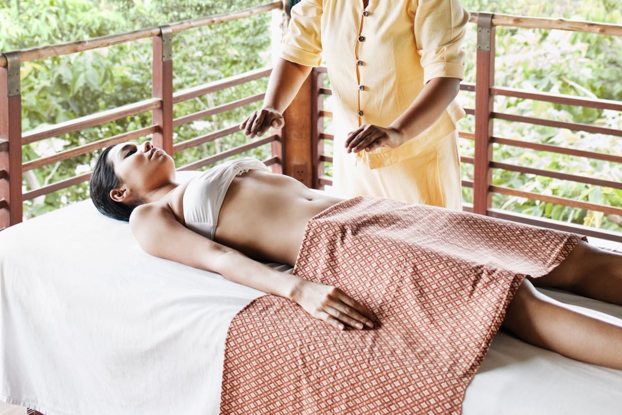 A woman receives reiki, an energy healing treatment, at the spa at Kamalaya resort in Koh Samui, Thailand, Jan. 7, 2009.