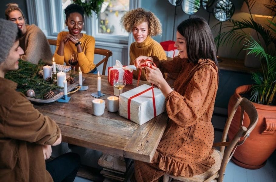 Picture representing a group of friends practicing holiday wellness