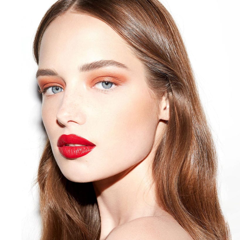A model wearing Kosas 10-Second Liquid Eyeshadow.