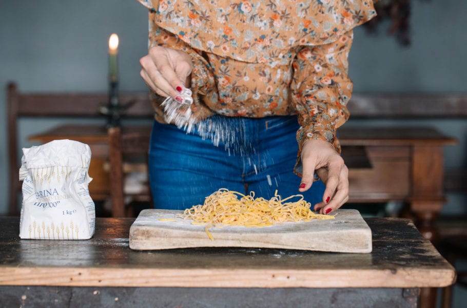 A woman making homemade pasta.