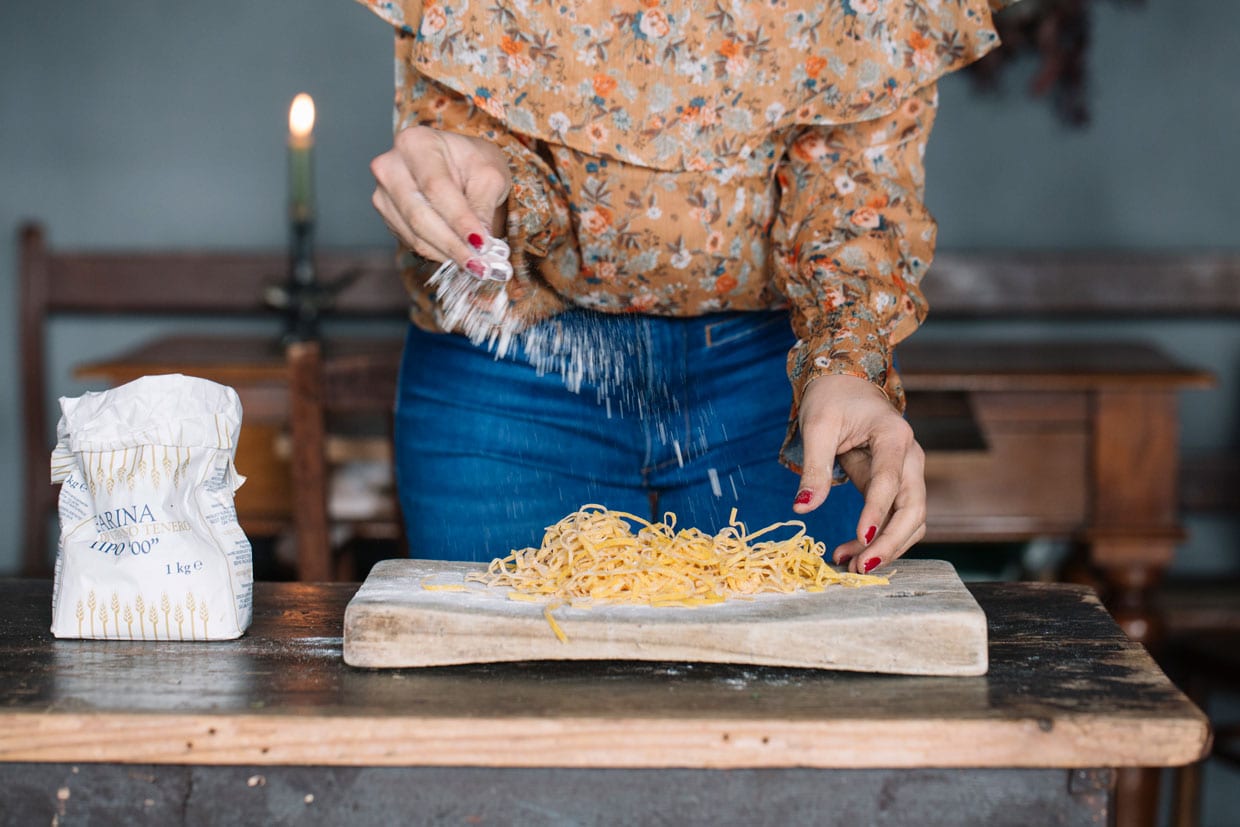 A woman making homemade pasta.