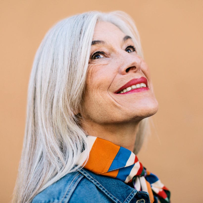 A portrait of a smiling senior woman.