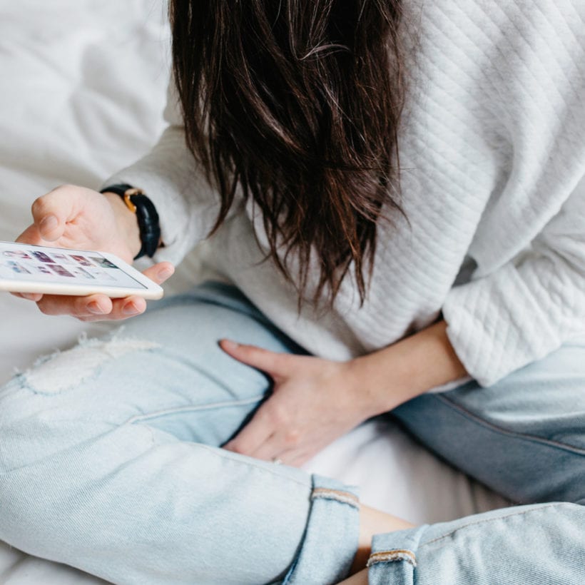 A woman using her phone.