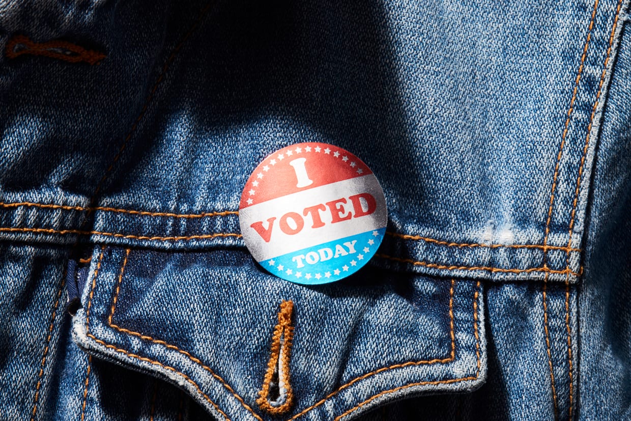 An 'I Voted Sticker' on a jean jacket.