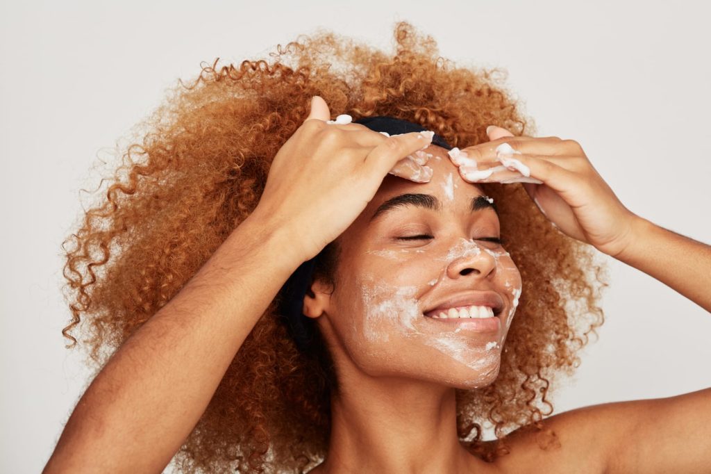 Amazing African American Woman washing face - Beautiful afro hair