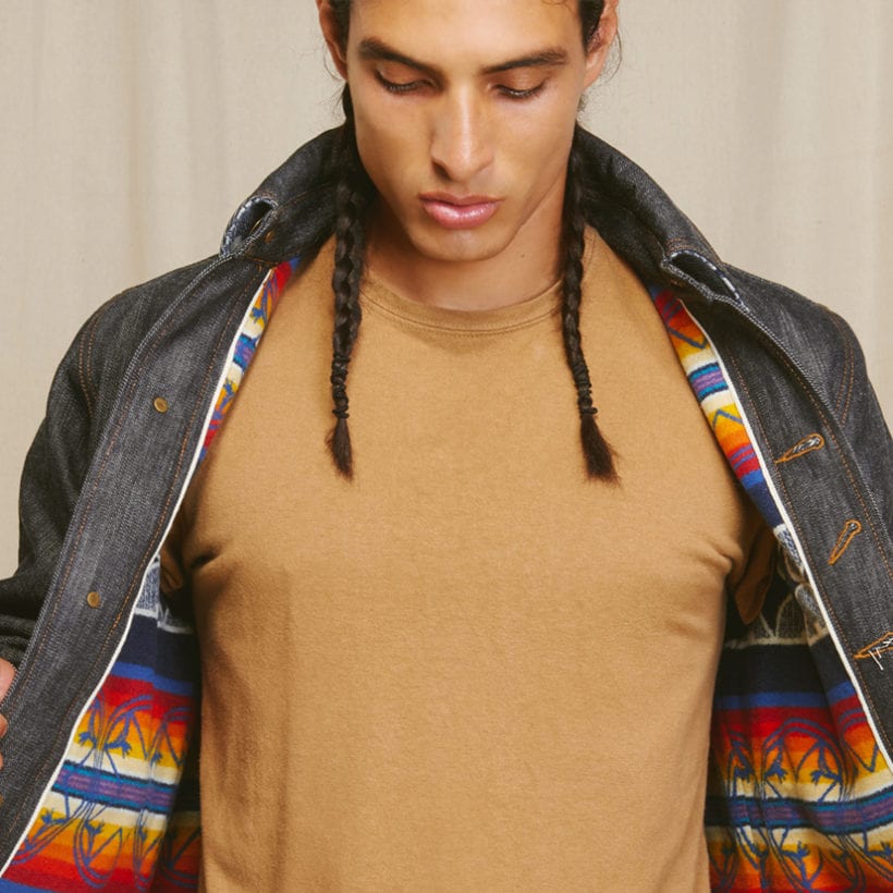 A man wearing the Ginew Heritage Coat.