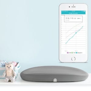 Hatch Baby Grow Smart Changing Pad and Scale in a nursery.