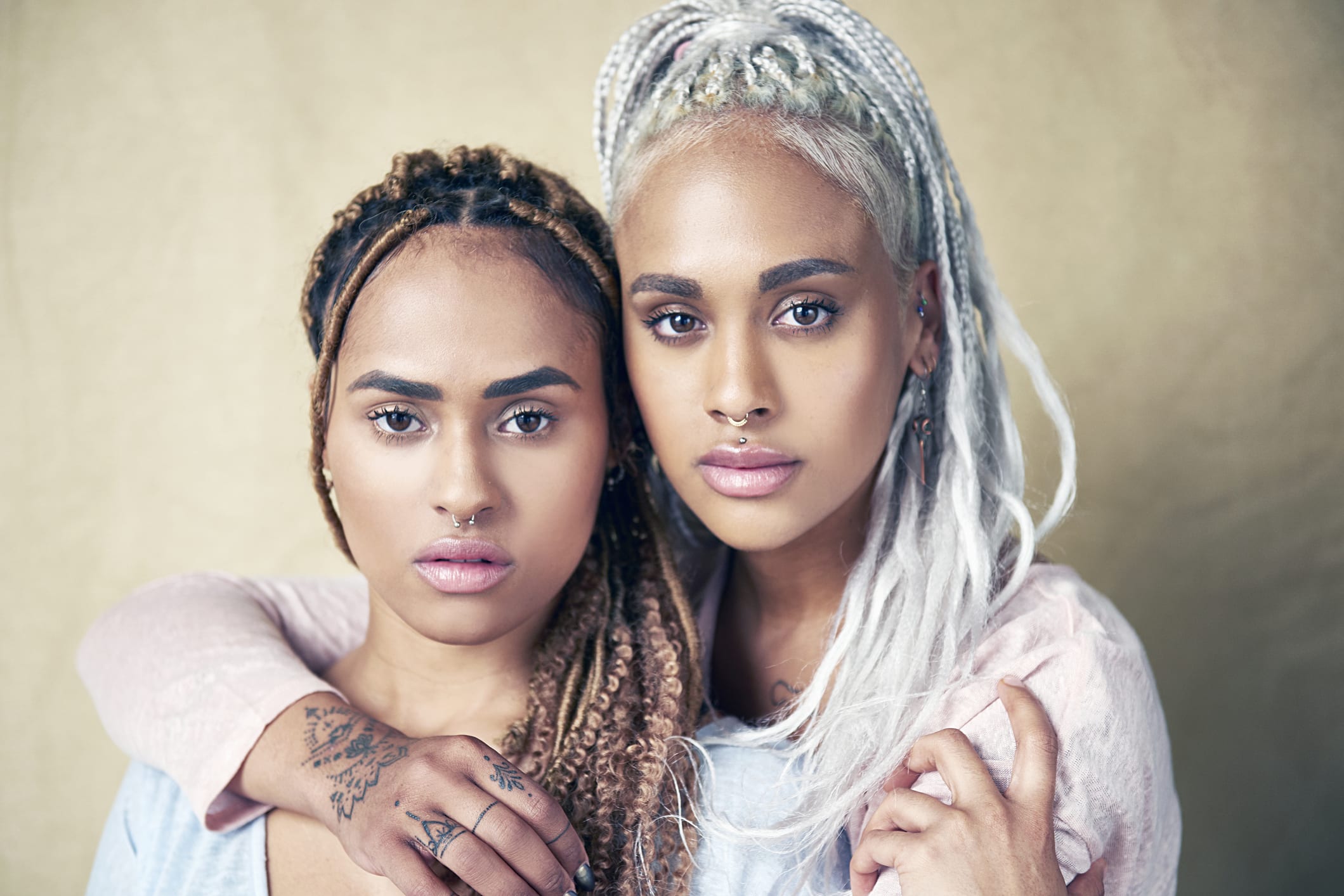 portrait of twin sisters with dreadlocks