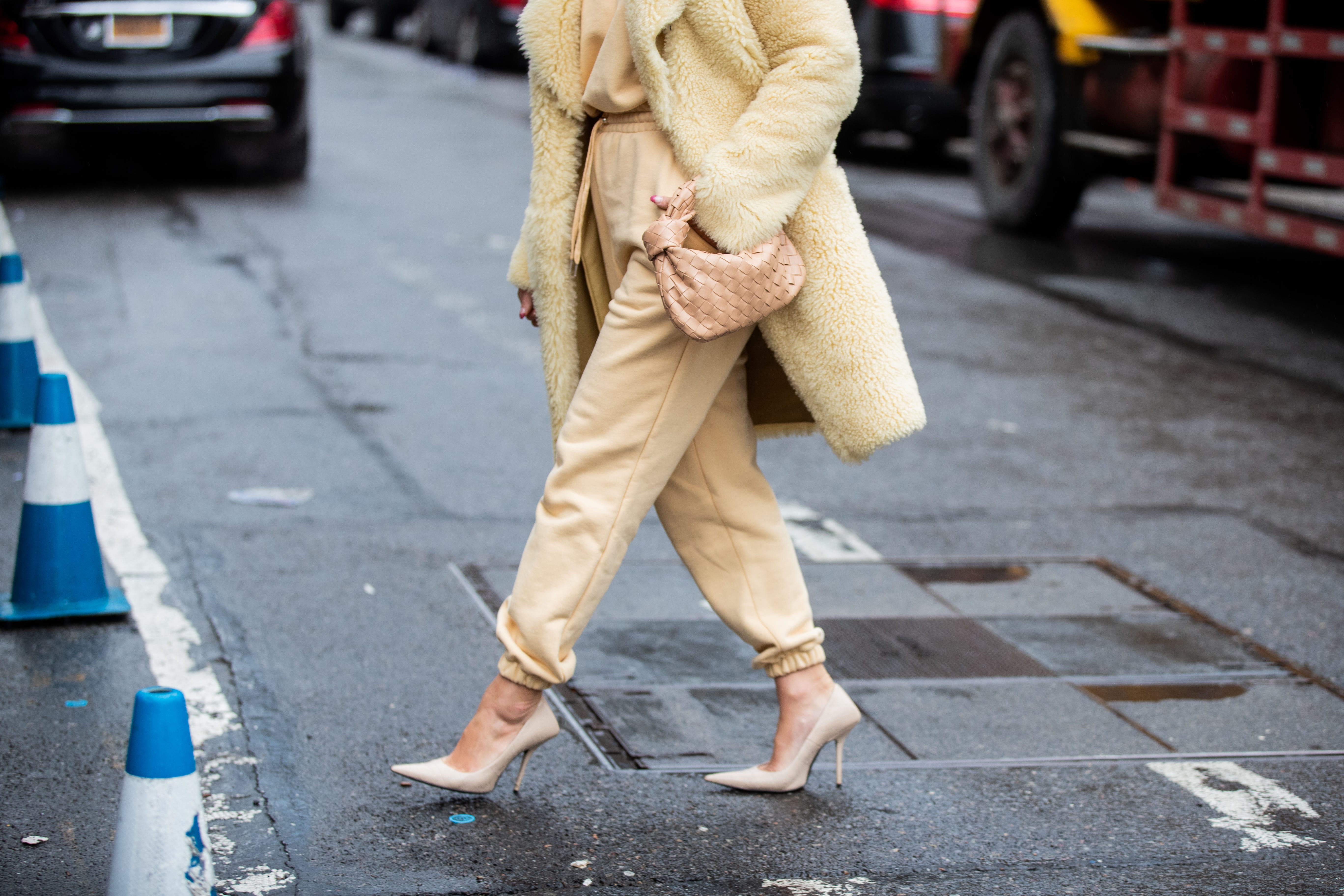 NEW YORK, NEW YORK - FEBRUARY 11: Tiffany Hsu is seen wearing yellow coat, beige pants and jumper, Bottega bag outside Gabriela Hearst during New York Fashion Week Fall / Winter on February 11, 2020 in New York City. (Photo by Christian Vierig/Getty Images)