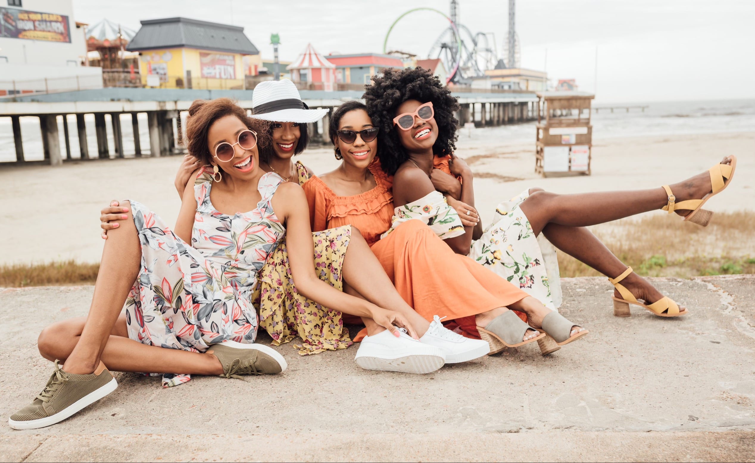 Four beautiful Black girls on the pier