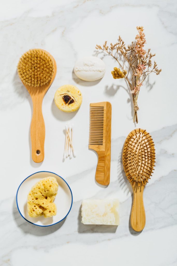 Zero waste, organic and responsible with the environment products for body and hair care. They are placed on a marble background. Natural hard light.