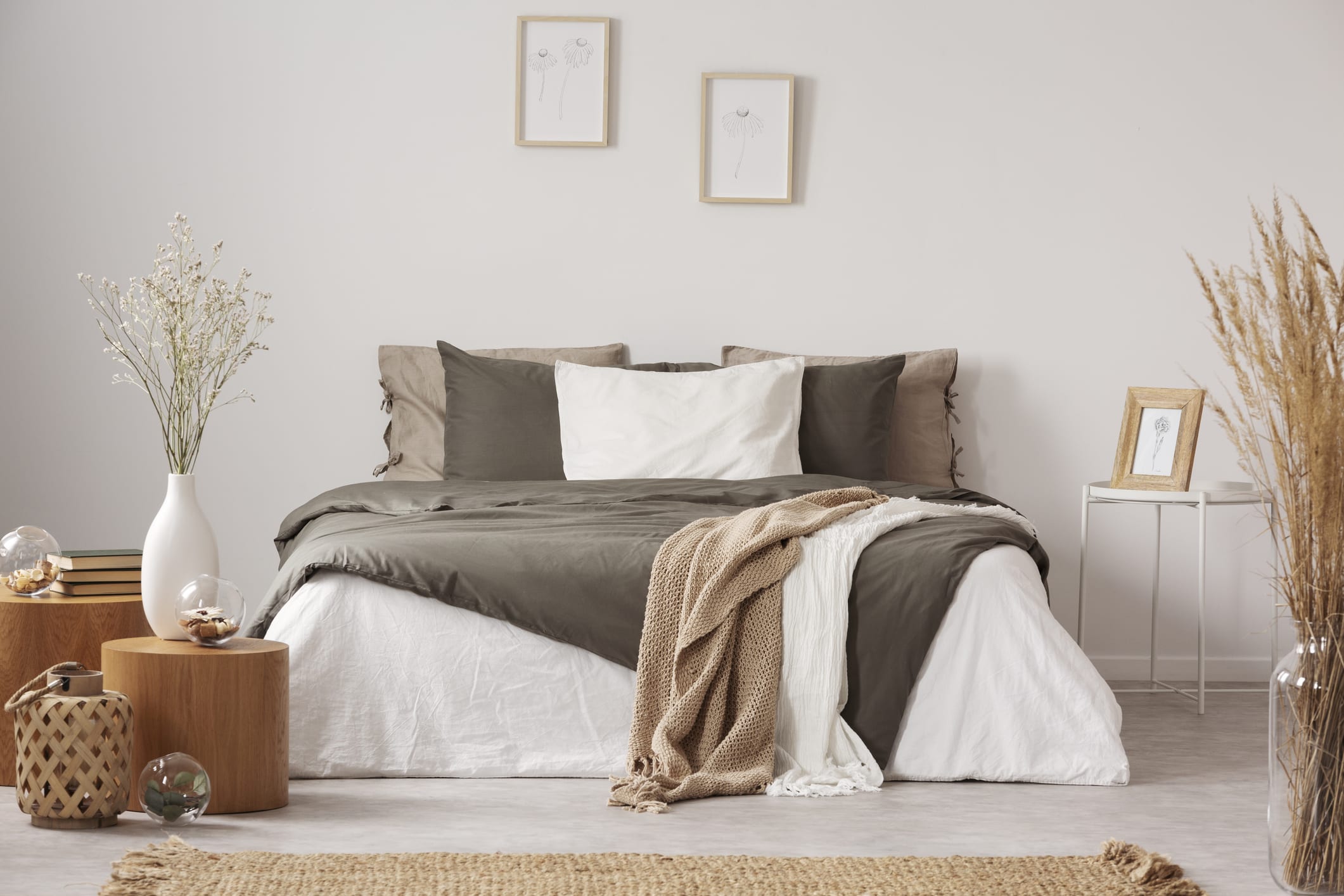 Spacious bedroom interior in beige and olive colour