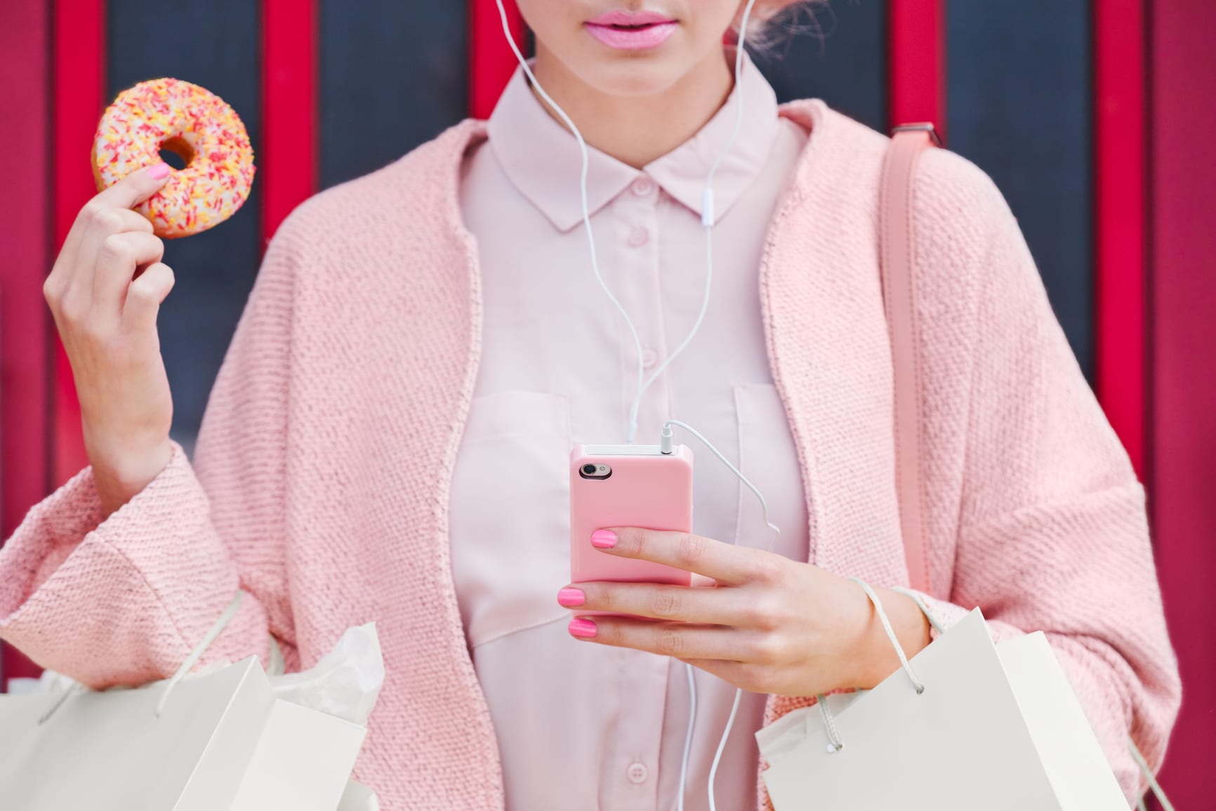 Pink Shopping Lady with doughnut using technology