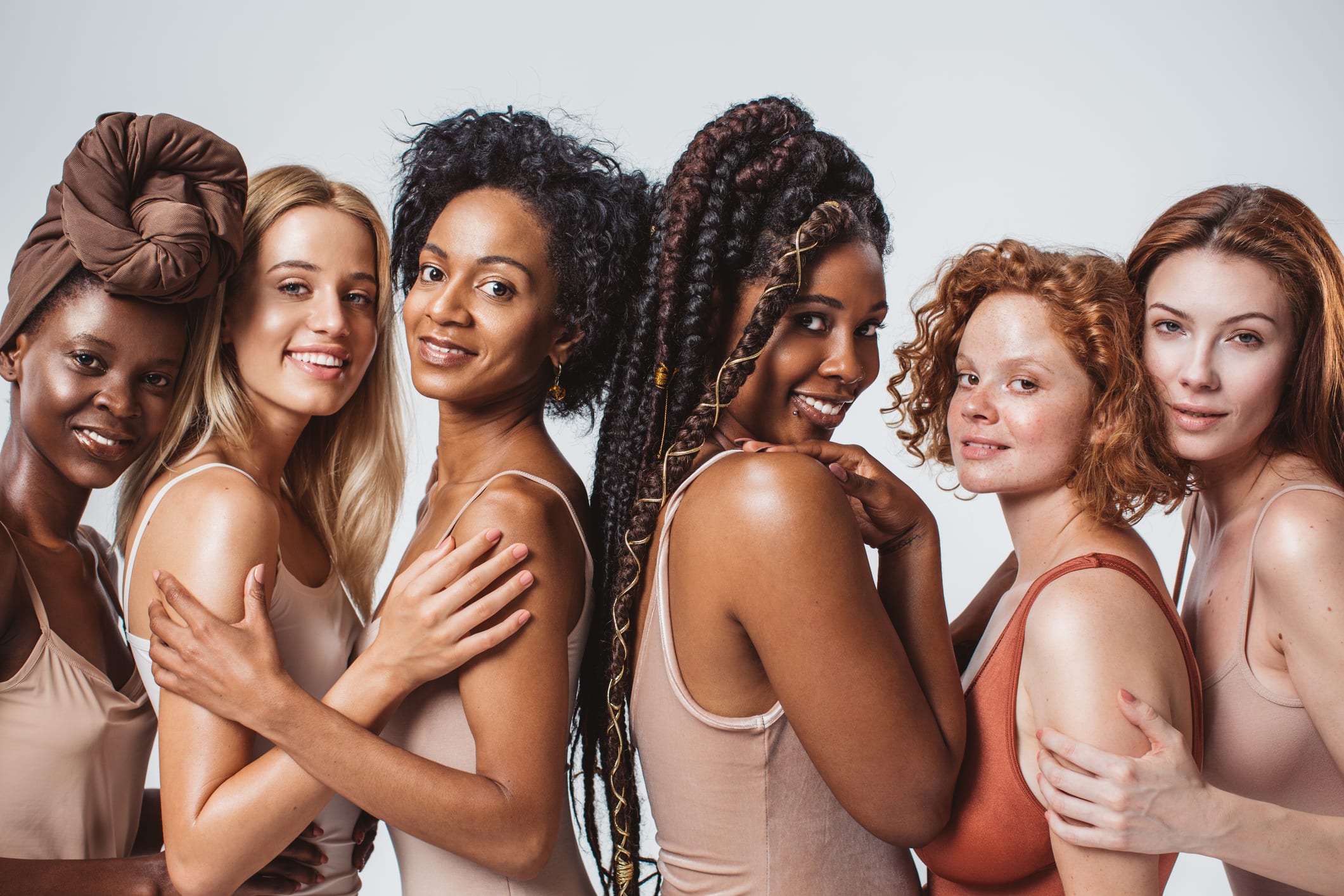 Group of women with different body type in underwear, studio shot.