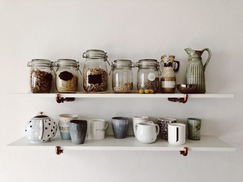 Close-Up Of Jars And Cup