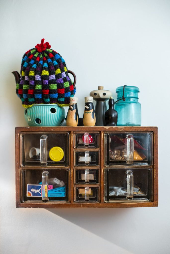 A kitchen shelf in Demark filled to the brim with odd ornements from around the world.