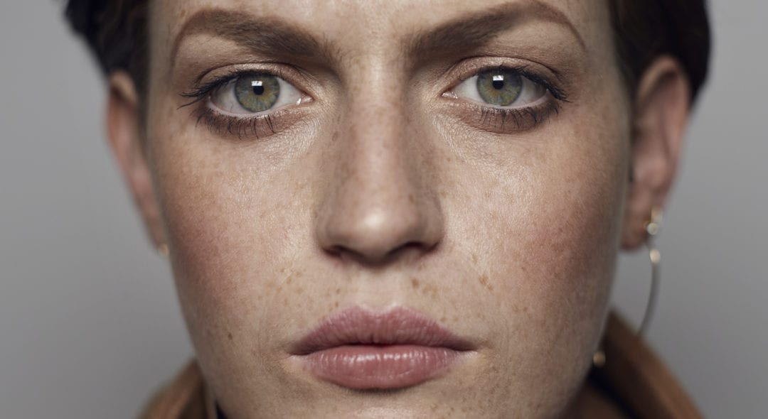 Studio portrait shoot with non-binary people photographed in cinematic lighting