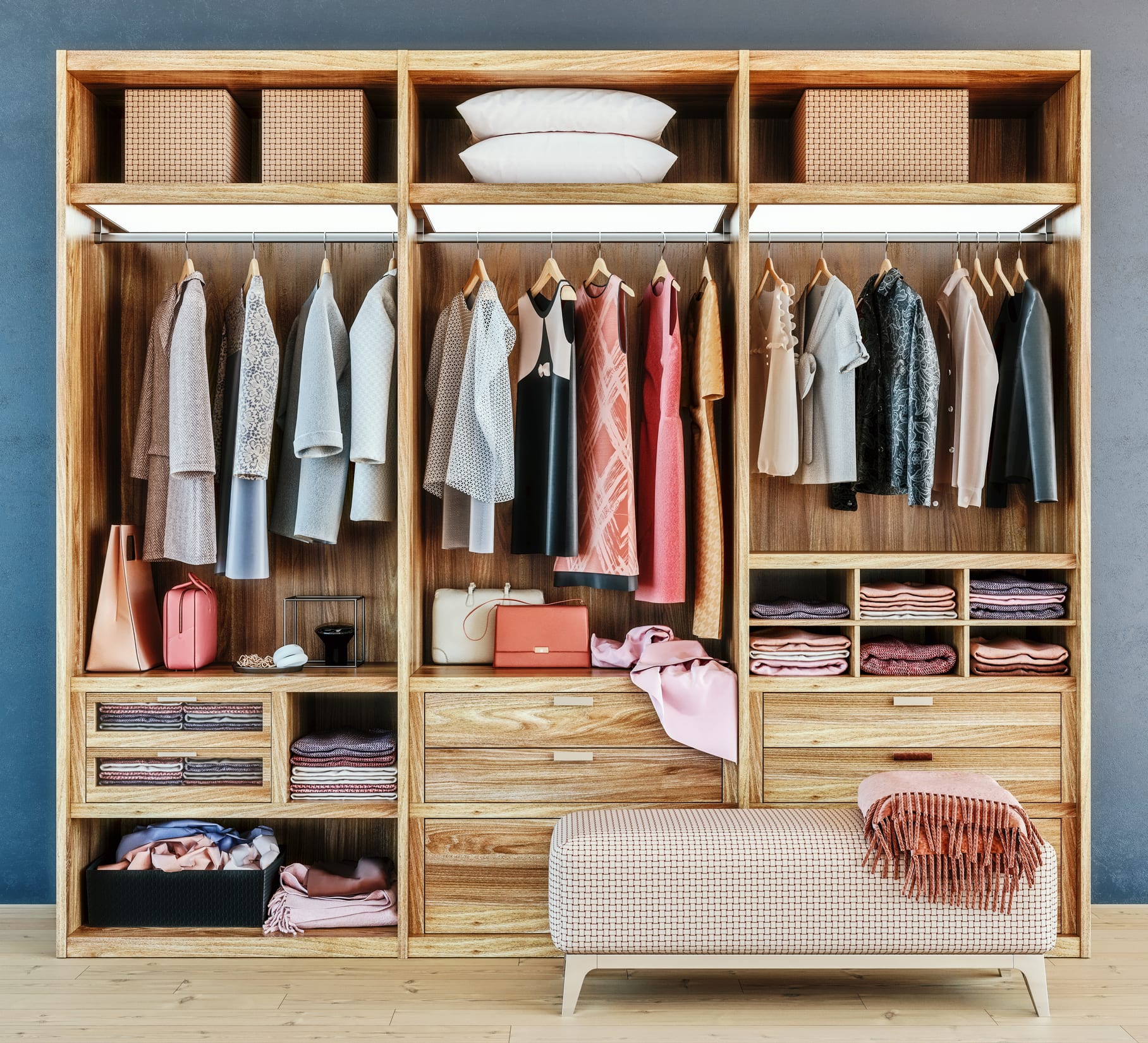 modern wooden wardrobe with clothes hanging on rail in walk in closet design interior, 3d rendering