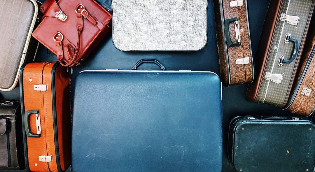 Vintage bags and suitcases on conveyor belt in an airport