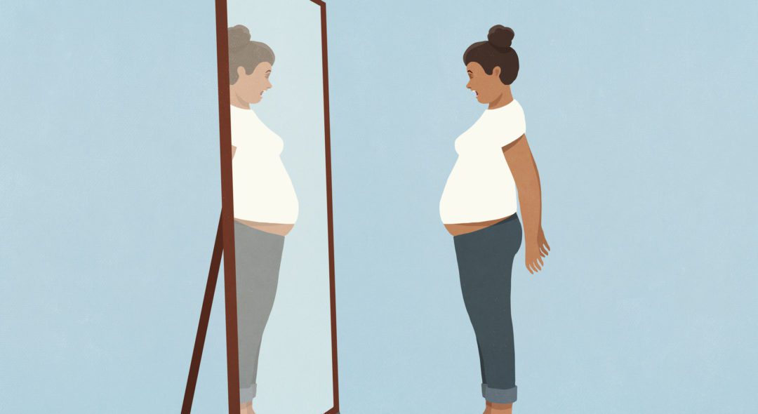 Woman looking at large stomach in mirror