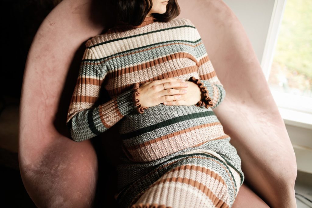 young pregnant woman at home